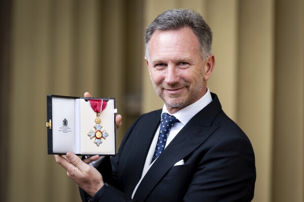 Team Principal and Chief Executive Officer of Red Bull Racing Christian Horner poses after being made a Commander of the Order of the British Empire at an Investiture ceremony at Buckingham Palace in London, Wednesday Dec. 18, 2024. (Aaron Chown/PA via AP, Pool)