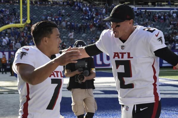 Atlanta Falcons kicker Younghoe Koo (7) and quarterback Matt Ryan (2) celebrate after their win over the New York Giants after an NFL football game, Sunday, Sept. 26, 2021, in East Rutherford, N.J. (AP Photo/Bill Kostroun)