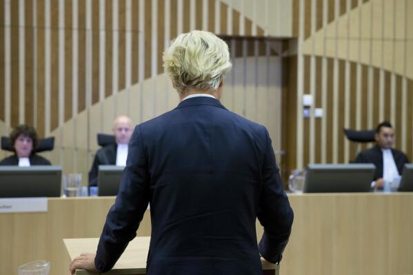FILE- In this Nov. 23, 2016, file photo, populist anti-Islam lawmaker Geert Wilders addresses the court at the high-security court near Schiphol Airport, Amsterdam, to attend his hate-speech trial that pits freedom of expression against the Netherlands' anti-discrimination laws. A Dutch appeals court upheld Friday the conviction of anti-Islam lawmaker Geert Wilders for insulting Moroccans in comments he made at an election night gathering in 2014. He was cleared of incitement to hate and discrimination. (AP Photo/Peter Dejong, File)