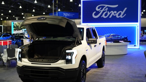 FILE - The Ford F-150 Lightning displayed at the Philadelphia Auto Show, Jan. 27, 2023, in Philadelphia. Ford Motor Co. is going through another round of white-collar job cuts as the company continues to reduce costs amid a transition to electric vehicles. (AP Photo/Matt Rourke, File)