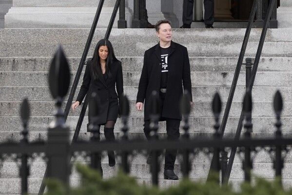 Elon Musk walks down the stairs from the Eisenhower Executive Office Building on the White House campus, Thursday, Feb. 13, 2025, in Washington. (Photo/Alex Brandon)