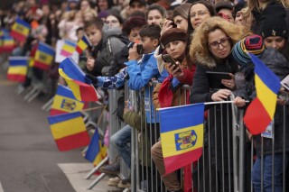 Crowds watch the National Day parade in Bucharest, Romania, Dec. 1, 2023. (AP Photo/Vadim Ghirda)