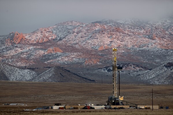 A drill rig stands at a Fervo Energy geothermal site under construction near Milford, Utah, Sunday, Nov. 26, 2023. In Nevada, Fervo’s first operational pilot project has begun pumping carbon-free electricity onto the state's grid to power Google data centers, Google announced Tuesday, Nov. 28. Fervo is using the Nevada pilot to launch larger projects like this one in Utah. (AP Photo/Ellen Schmidt)
