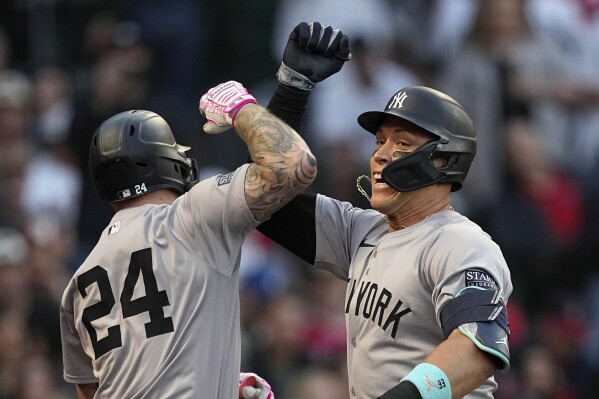 New York Yankees' Aaron Judge, right, celebrates with Alex Verdugo after hitting a two-run home run during the fourth inning of a baseball game against the Los Angeles Angels Thursday, May 30, 2024, in Anaheim, Calif. (AP Photo/Mark J. Terrill)