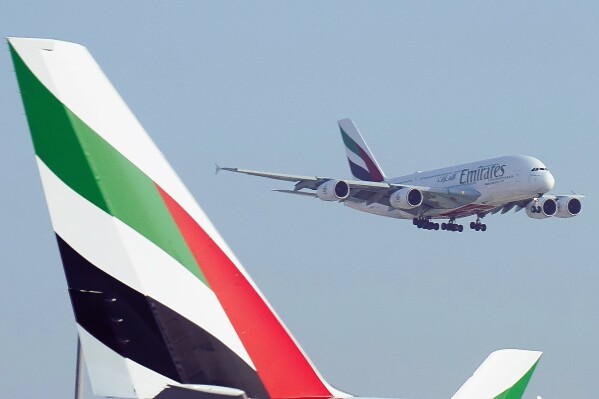 FILE - An Emirates Airbus A380 jumbo jet lands at Dubai International Airport in Dubai, United Arab Emirates, Friday, Sept. 9, 2022. The long-haul carrier Emirates announced Monday, May 13, 2024, it saw record profits of $4.7 billion in 2023 as the airline fully took flight after the turbulent years of the coronavirus pandemic disrupted its operations.(AP Photo/Jon Gambrell, File)