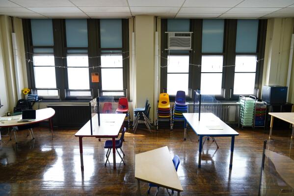 FILE - Desks are spaced apart ahead of planned in-person learning at an elementary school on March 19, 2021, in Philadelphia. Pandemic school disruptions resulted in the largest drop in reading achievement in 30 years, according to newly released national test scores on Thursday, Sept. 1, 2022. The data is from 9-year-olds who took the National Assessment of Educational Progress in 2020 and 2022. (AP Photo/Matt Rourke, File)