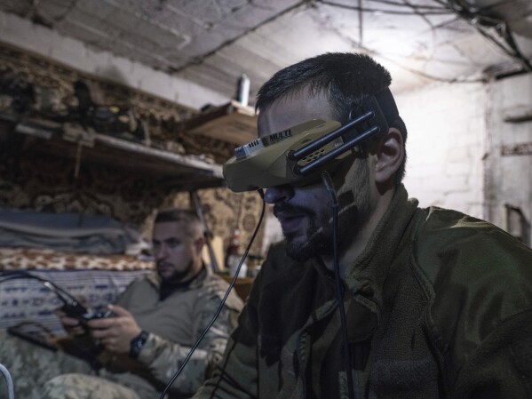 In this photo provided by Ukraine's No. 93 Leopard Horodniard separate Mechanized Brigade Press Services, soldiers operate drones directed at Russian positions from cover in Kostiantinibka, Donetsk region of Ukraine on May 23, 2025 (Iryna Rybakova/Ukraine's 93rd Mechanized Brigade)