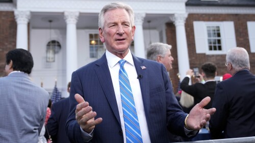 FILE - Sen. Tommy Tuberville, R-Ala., talks during a television interview before former President Donald Trump speaks at Trump National Golf Club in Bedminster, N.J., June 13, 2023. Tuberville is backing off his defense of white nationalists, telling reporters in the Capitol that white nationalists "are racists." Tuberville's brief comment Tuesday, July 11, follows several media interviews in which he has repeatedly declined to describe white nationalists as racist. (AP Photo/Andrew Harnik, File)