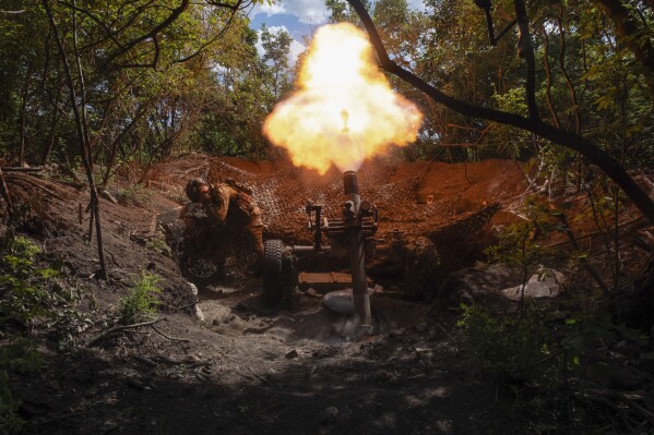 Servicemen of Ukraine's 93rd Mechanised Brigade fire a French MO-120-RT heavy mortar at the Russian forces on the front line near the city of Bakhmut in Ukraine's Donetsk region on Wednesday, May 22, 2024. (Iryna Rybakova via AP)
