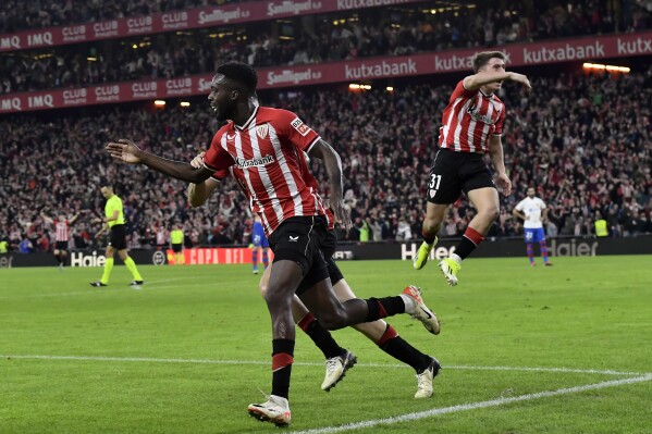 Athletic Bilbao's Inaki Williams celebrates scoring his side's third goal during the Copa del Rey quarterfinals soccer match between Athletic Bilbao and Barcelona at the San Mames stadium in Bilbao, Spain, on Wednesday, Jan. 24, 2024. (AP Photo/Alvaro Barrientos)