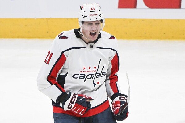 Washington Capitals' Aliaksei Protas celebrates his goal against the Montreal Canadiens during the third period of an NHL hockey game Saturday, Feb. 17, 2024, in Montreal. (Graham Hughes/The Canadian Press via AP)