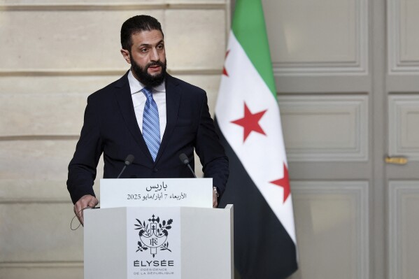 Syria's interim President Ahmad al-Sharaa, speaks during a joint press conference with French President Emmanuel Macron after a meeting at the Elysee Palace in Paris, Wednesday, May 7, 2025. (Stephanie Lecocq/Pool via AP)