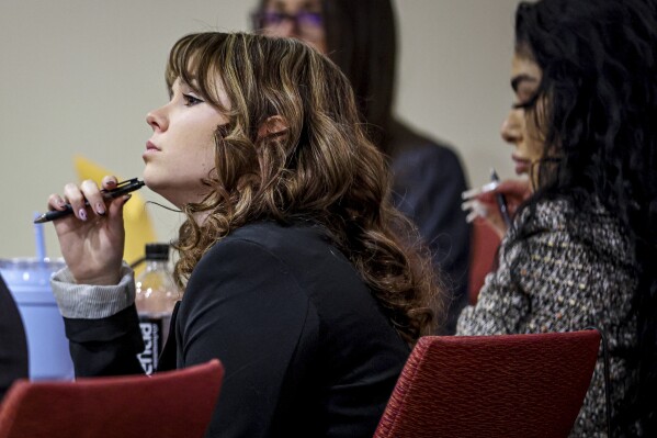 Hannah Gutierrez-Reed listens while expert witness Bryan Carpenter testifies during Gutierrez-Reed's trial on involuntary manslaughter and tampering with evidence charges in state district court in Santa Fe, N.M., on Thursday, Feb. 29, 2024. (Gabriela Campos/Santa Fe New Mexican via AP, Pool)