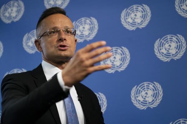 Peter Szijjarto, Hungary's minister of foreign affairs and trade, speaks during an interview with the Associated Press at United Nations headquarters, Thursday, Sept. 23, 2021, during the 76th Session of the U.N. General Assembly in New York. (AP Photo/John Minchillo)
