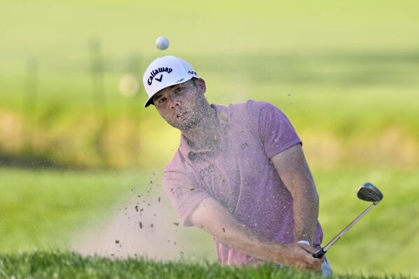 Sam Burns hits from the sand trap on the 16th hole during the first round of the Valspar Championship golf tournament Thursday, March 17, 2022, at Innisbrook in Palm Harbor, Fla. (AP Photo/Chris O'Meara)