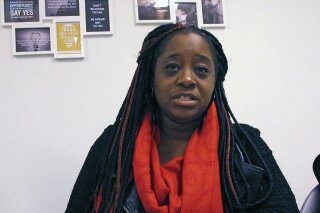 In this Oct. 3, 2018, photograph, Kiah Morris, a former Vermont state representative, discusses threats and harassment she's faced, during an interview in Bennington, Vt. Morris, the only black woman in the Vermont legislature, has resigned. (AP Photo/Lisa Rathke)
