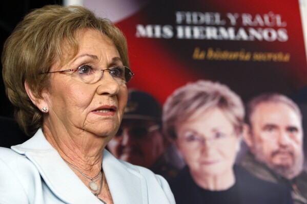 FILE - Juanita Castro, sister of Fidel Castro, talks to a reporter, Oct. 27, 2009, in Miami. Juanita Castro, the anti-communist sister of Cuban rulers Fidel and Raul Castro who worked with the CIA against their government, has died in Miami at age 90. Journalist María Antonieta Collins, who co-wrote Juanita Castro’s 2009 book, “Fidel and Raúl, My Brothers. The Secret History,