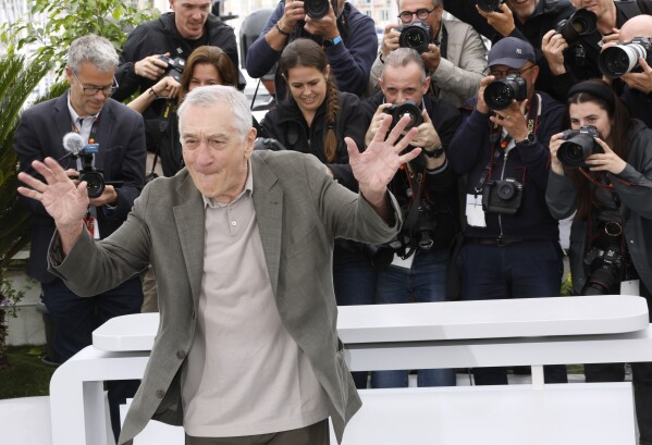 De Niro poses for photographers while promoting "Killers of the Flower Moon'" at Cannes in 2023. (Photo by Joel C Ryan/Invision/AP)