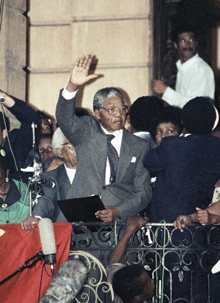 FILE - In this Feb. 11, 1990 file photo, Nelson Mandela gestures as he addresses supporters at the Cape Town, South Africa City Hall after his release from 27 years in prison. Tuesday, Feb. 11, 2020 marks the 30 year anniversary of the release of the former South African president. (AP Photo/File)