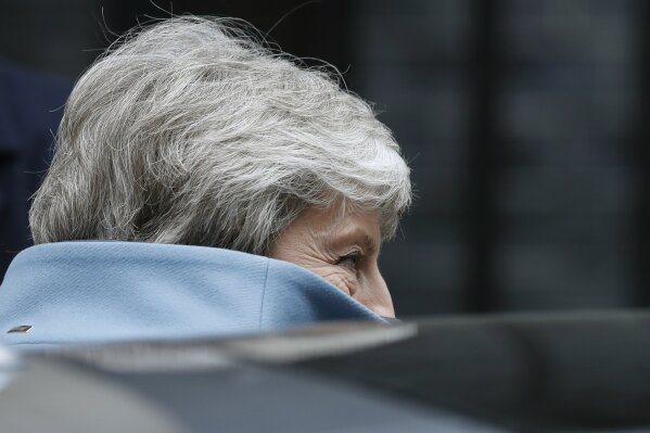
              Britain's Prime Minister Theresa May gets into her car as she leaves 10 Downing street to attend her weekly Prime Minster's Questions at the House of Commons, in London, Wednesday, March 27, 2019.  British lawmakers are preparing to vote Wednesday on alternatives for leaving the European Union as they seek to end an impasse following the overwhelming defeat of the deal negotiated by Prime Minister Theresa May. (AP Photo/Alastair Grant)
            