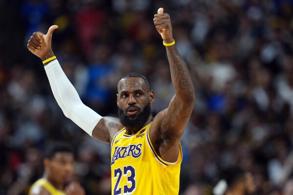 LeBron James intends to sign a new deal with the Lakers, AP source says | AP News