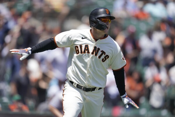 FILE - San Francisco Giants' Joc Pederson watches his two-run home run during the first inning of a baseball game against the New York Mets in San Francisco, Wednesday, May 25, 2022. Pederson is scared to fly and shortly after arriving in San Francisco he began working with the club's director of mental health and wellness Shana Alexander and human performance specialist Harvey Martin to cope with his flight anxiety. (AP Photo/Jeff Chiu, File)