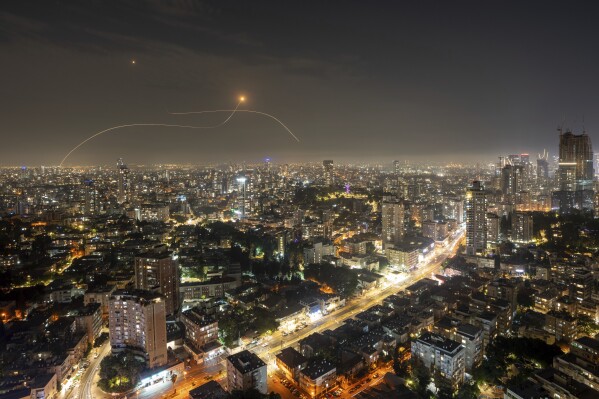 Israeli Iron Dome air defense system fires to intercept a rocket fired from the Gaza Strip, in central Israel, Saturday, Oct. 28, 2023. (AP Photo/Oded Balilty)