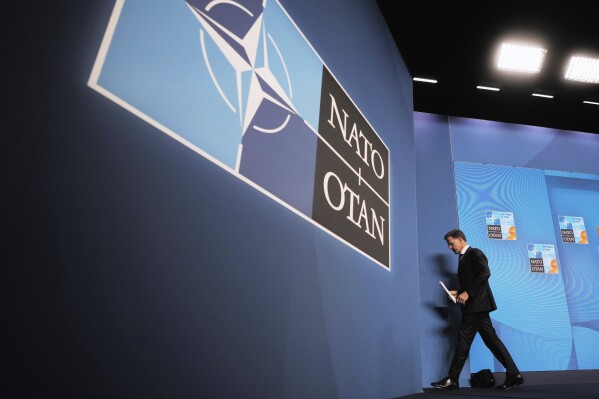 NATO Secretary General Mark Rutte leaves a media conference ahead of the NATO summit in The Hague, Netherlands, Monday, June 23, 2025. (AP Photo/Markus Schreiber)