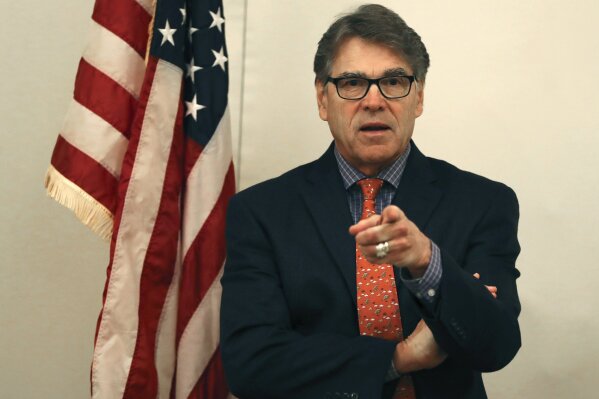 The outgoing U.S. Energy Secretary Rick Perry talks to the journalists during a roundtable presser in Dubai, United Arab Emirates, Saturday, Oct. 26, 2019. (AP Photo/Kamran Jebreili)