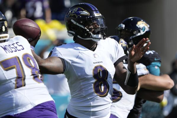 Baltimore Ravens quarterback Lamar Jackson (8) sets back to pass during the first half of an NFL football game against the Jacksonville Jaguars, Sunday, Nov. 27, 2022, in Jacksonville, Fla. (AP Photo/John Raoux)