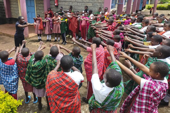 I'm Worth Defending officer Amelia Awuor, left, demonstrates self-defense techniques at Enkakenya Centre for Excellence in Narok County, Kenya, on Feb. 1, 2025. (AP Photo/Nicholas Komu)