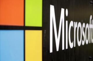 FILE - In this Wednesday, Feb. 3, 2021 file photo, the Microsoft company logo is displayed at their offices in Sydney. Microsoft pledged Thursday May 6, 2021, to let European Union business and public sector customers keep and process their cloud computing data inside the 27-nation bloc, amid concerns about the U.S. government accessing sensitive information. (AP Photo/Rick Rycroft, File)