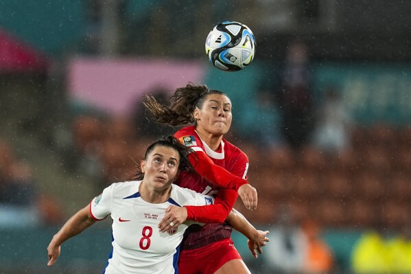Norway's Vilde Boe Risa, left, fights for a high ball with Switzerland's Ramona Bachmann during the Women's World Cup Group A soccer match between Switzerland and Norway in Hamilton, New Zealand, Tuesday, July 25, 2023. The match ended in a 0-0 draw. (AP Photo/Abbie Parr)