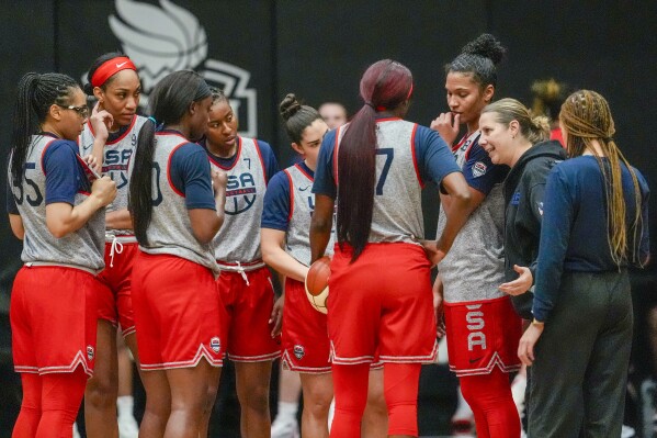 The United States women's national team head coach Cheryl Reeve, second from right, speaks to her players after practice during the team's training camp, Sunday, Feb. 4, 2024, in New York. The U.S. announced their team that will play in a pre-Olympic tournament in Belgium this week. (APPhoto/Mary Altaffer)