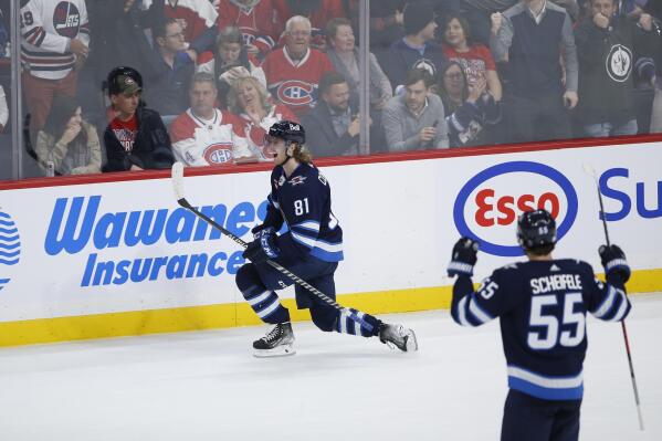 Winnipeg Jets' Kyle Connor (81) celebrates his overtime goal against the Montreal Canadiens during an NHL hockey game Thursday, Nov. 3, 2022, in Winnipeg, Manitoba. (John Woods/The Canadian Press via AP)