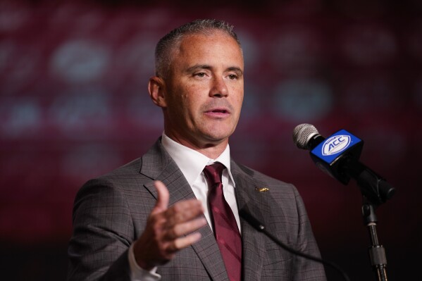 FILE - Florida State head coach Mike Norvell speaks during the Atlantic Coast Conference NCAA college football media days Wednesday, July 26, 2023, in Charlotte, N.C. Florida State's most anticipated season in nearly a decade begins in three weeks against Southeastern Conference heavyweight LSU in Orlando. (AP Photo/Erik Verduzco, File)