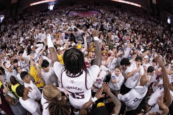 Texas A&M Aggies guard Manny Obaseki (35) celebrates with the A&M student section after an NCAA college basketball game against Alabama in College Station, Texas, Saturday, March, 5, 2023. (Logan Hannigan-Downs/College Station Eagle via AP)