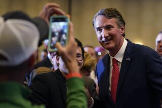 Virginia Gov.-elect Glenn Youngkin greets supporters at an election night party in Chantilly, Va., early Wednesday, Nov. 3, 2021, after he defeated Democrat Terry McAuliffe. (AP Photo/Andrew Harnik)