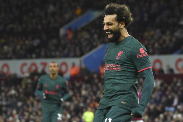 Liverpool's Mohamed Salah celebrates after scoring his side's opening goal during the English Premier League soccer match between Aston Villa and Liverpool at Villa Park in Birmingham, England, Monday, Dec. 26, 2022. (AP Photo/Rui Vieira)