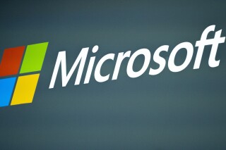FILE - The Microsoft logo is pictured at the Mobile World Congress 2023 in Barcelona, Spain, on March 2, 2023. Social media users are falsely claiming that the Mircosoft will "disable computers" if users share certain types of content. (AP Photo/Joan Mateu Parra, File)