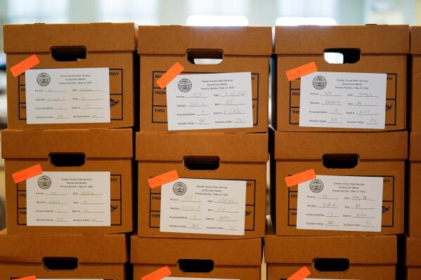 Boxes of recounted ballots from the recent Pennsylvania primary election are stacked at the Chester County Voter Services office in West Chester, Pa., Wednesday, June 1, 2022. (AP Photo/Matt Rourke)