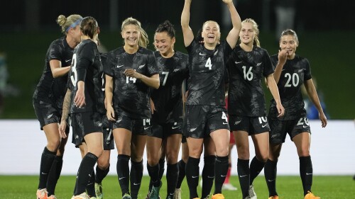 New Zealand's CJ Bott, third right, reacts after scoring her team's first goal during the New Zealand and Vietnam warm up match ahead of the women's World Cup in Napier, New Zealand, Monday, July 10, 2023. (AP Photo/John Cowpland )