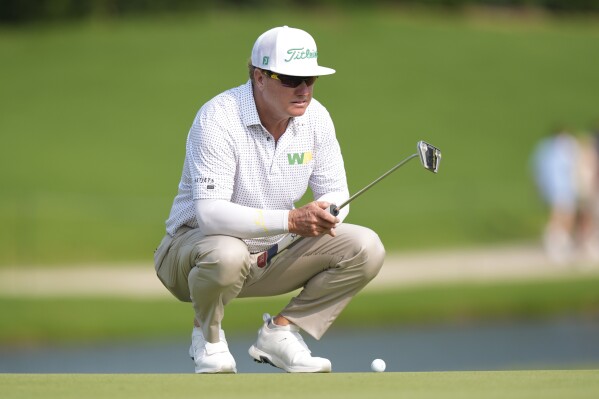 Charley Hoffman lines up a putt on the 16th hole during the first round of the Charles Schwab Challenge golf tournament at Colonial on Thursday, May 23, 2024, in Fort Worth, Texas. (AP Photo/LM Otero