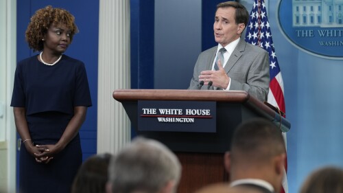 White House press secretary Karine Jean-Pierre, left, listens as National Security Council spokesman John Kirby speaks during the daily briefing at the White House in Washington, Monday, July 17, 2023. (AP Photo/Susan Walsh)