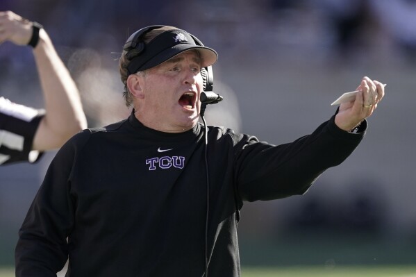 FILE - TCU head coach Gary Patterson talks to his players during the first half of an NCAA college football game against Kansas State, Saturday, Oct. 30, 2021, in Manhattan, Kan. Baylor is hiring former TCU coach Gary Patterson as a a senior consultant to head coach Dave Aranda, a person with direct knowledge of the move told The Associated Press on Thursday, Feb. 8, 2024. (AP Photo/Charlie Riedel, File)