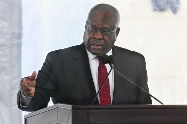 FILE - Supreme Court Justice Clarence Thomas delivers a keynote speech during a dedication of Georgia new Nathan Deal Judicial Center in Atlanta, Feb. 11, 2020. Reports that the wife of Thomas implored Donald Trump’s White House chief of staff to act to overturn the 2020 election results has put a spotlight on how justices decide whether to step aside from a case. (AP Photo/John Amis, File)