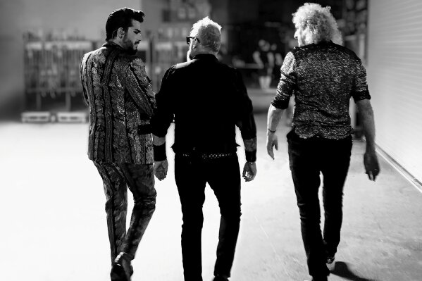 This album cover image released by Hollywood Records shows "Live Around the World" by Queen + Adam Lambert, releasing Friday, Oct. 2. (Hollywood Records via AP)