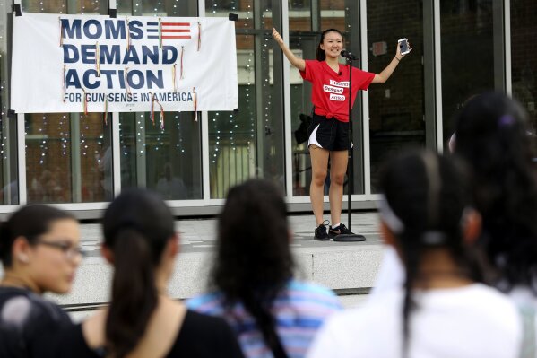 FILE - In this Aug. 11, 2019, file photo, Seo Yoon “Yoonie” Yang, with Students Demand Action, speaks during a vigil to remember the victims of the El Paso, Texas, and Dayton, Ohio, mass shootings and call for lawmakers to take action against gun violence at Miller Park in Chattanooga, Tenn. Not long before the deadly Atlanta-area shootings spread fear and anger through Asian American communities nationwide, police say the attacker legally bought a handgun. New gun laws won’t fix deep-seated problems such as racism, misogyny and violence, Yang said. But they can help keep guns out of the hands of people who would do harm in the meantime, she said. (Erin O. Smith/Chattanooga Times Free Press via AP)