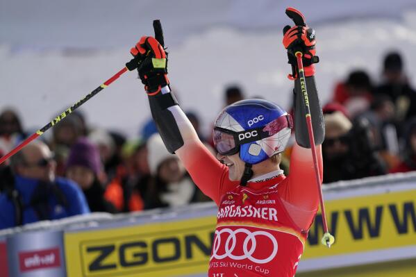 Switzerland's Marco Odermatt celebrates at the finish area of an alpine ski, men's World Cup giant slalom, in Val D'Isere, France, Saturday, Dec.10, 2022. (AP Photo/Giovanni Auletta)