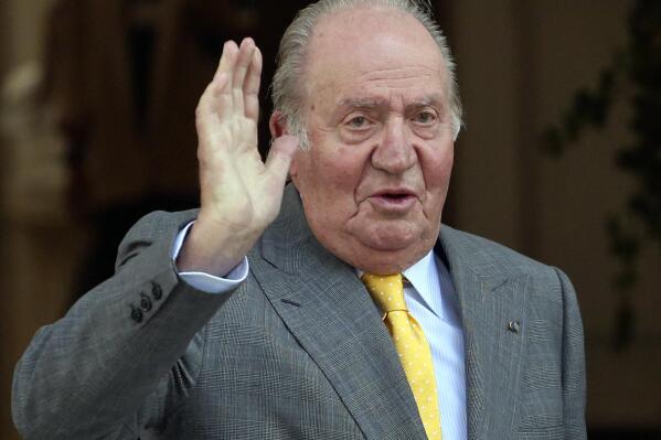FILE - Spain's former King Juan Carlos waves upon his arrival to the Academia Diplomatica de Chile, in Santiago. Spain's Royal House said on Monday March 7, 2022 that King Felipe VI is accepting his father's desire to return to Spain for periodical visits, although former king Juan Carlos I will remain based in the United Arab Emirates where he moved in 2020 following probes into his financial dealings. The prosecutors didn't find evidence to take the former monarch to court because much of the financial misbehavior, involving millions of euros (dollars) in undeclared accounts, happened when Juan Carlos was protected by immunity as king of Spain and other possible fraud fell out of the statute of limitations. (AP Photo/Esteban Felix, File)